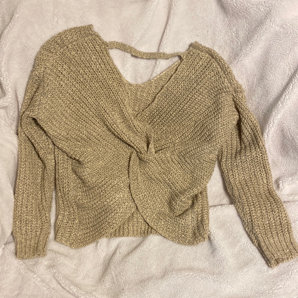Shirley Lee Sweater with a twist back . Open